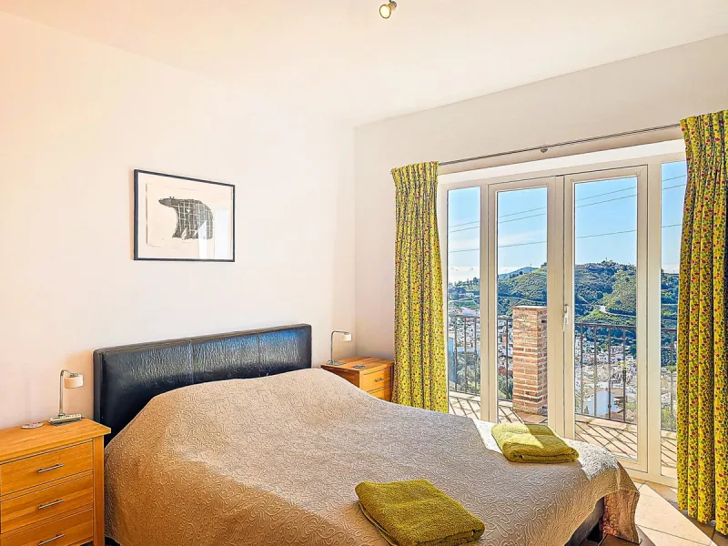 This beautiful modern villa with 5 bedrooms and 3 bathrooms enjoys an enviable elevated position above the charming white village of Cómpeta, offering sweeping views of the Mediterranean Sea, rolling countryside, and the village rooftops below. Stylish, s