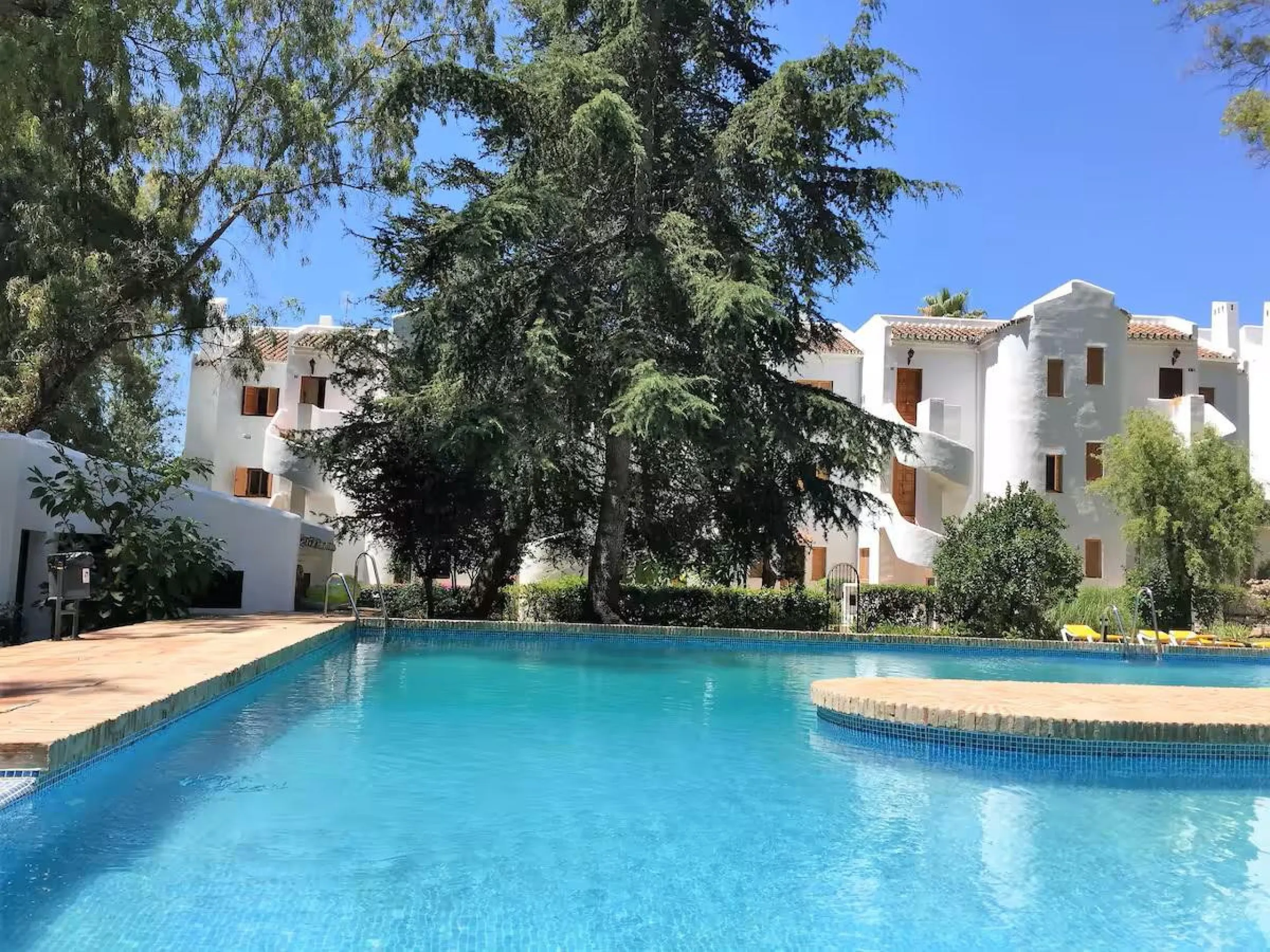 Located in one of the most established and beautifully maintained urbanisations in Nueva Andalucía, this charming two bedroom, two bathroom apartment offers comfort, space and an exceptional lifestyle setting in the heart of the Golf Valley.
