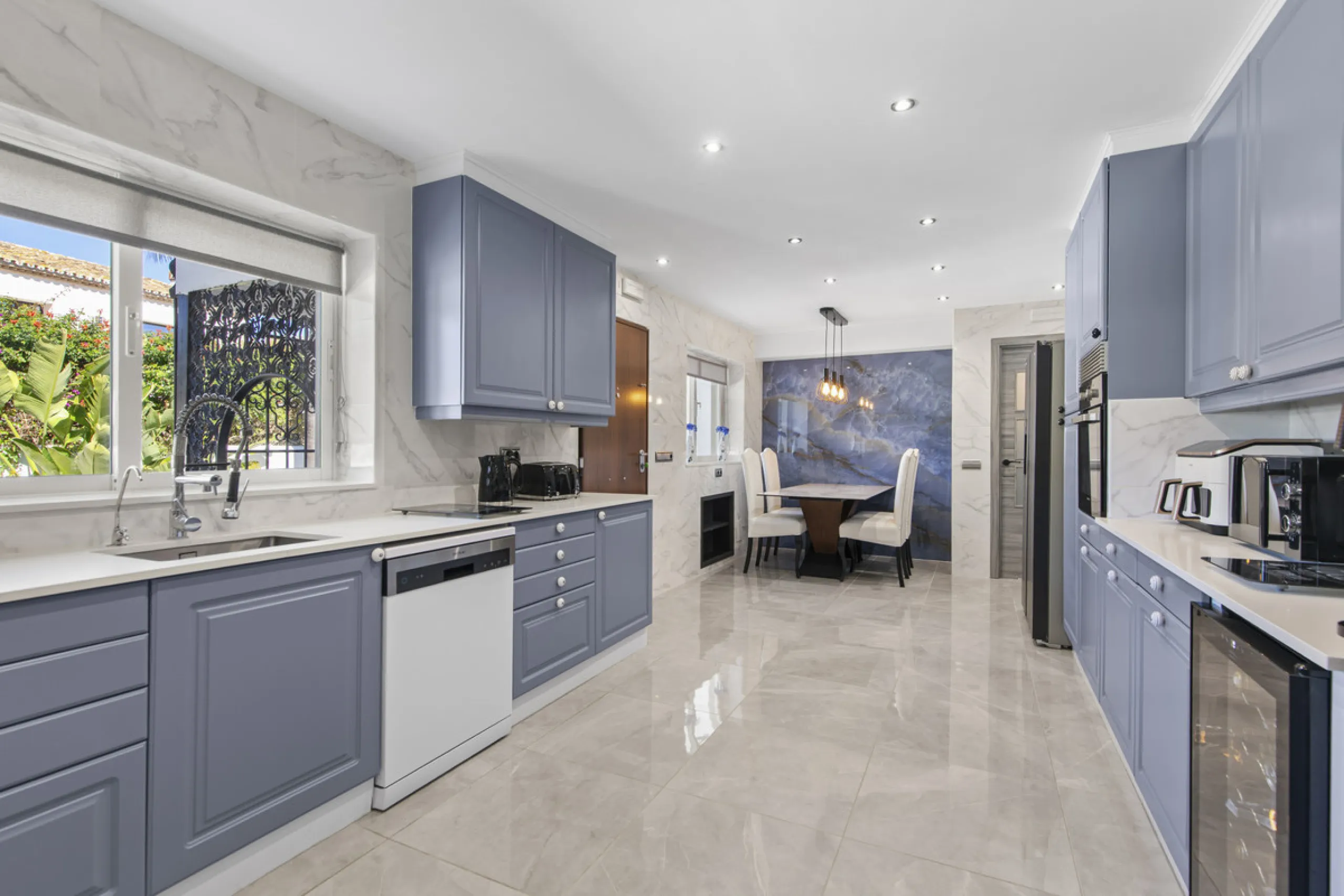 Located in the prestigious area of Guadalmina Baja – Casasola, just a short stroll from the beach, this stunning recently renovated villa sits on an exceptionally large private plot, offering space, privacy, and effortless coastal living.