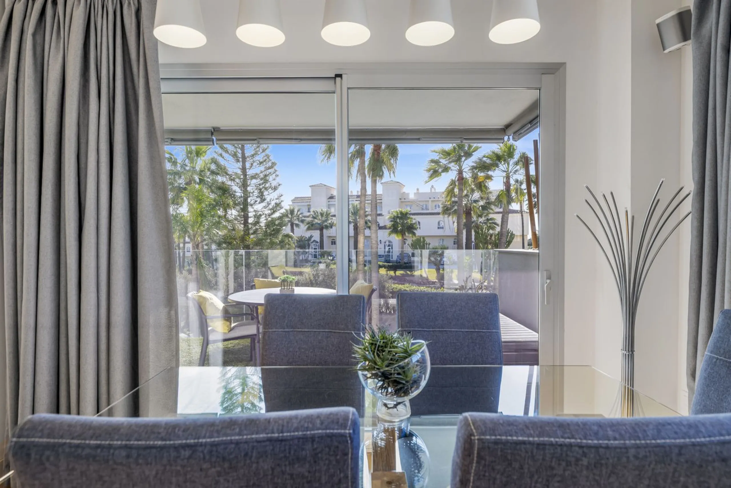 Discover this stylish first-floor apartment in the exclusive El Chaparral area of Mijas Costa, featuring a southwest orientation and a prime location between Fuengirola and La Cala de Mijas.