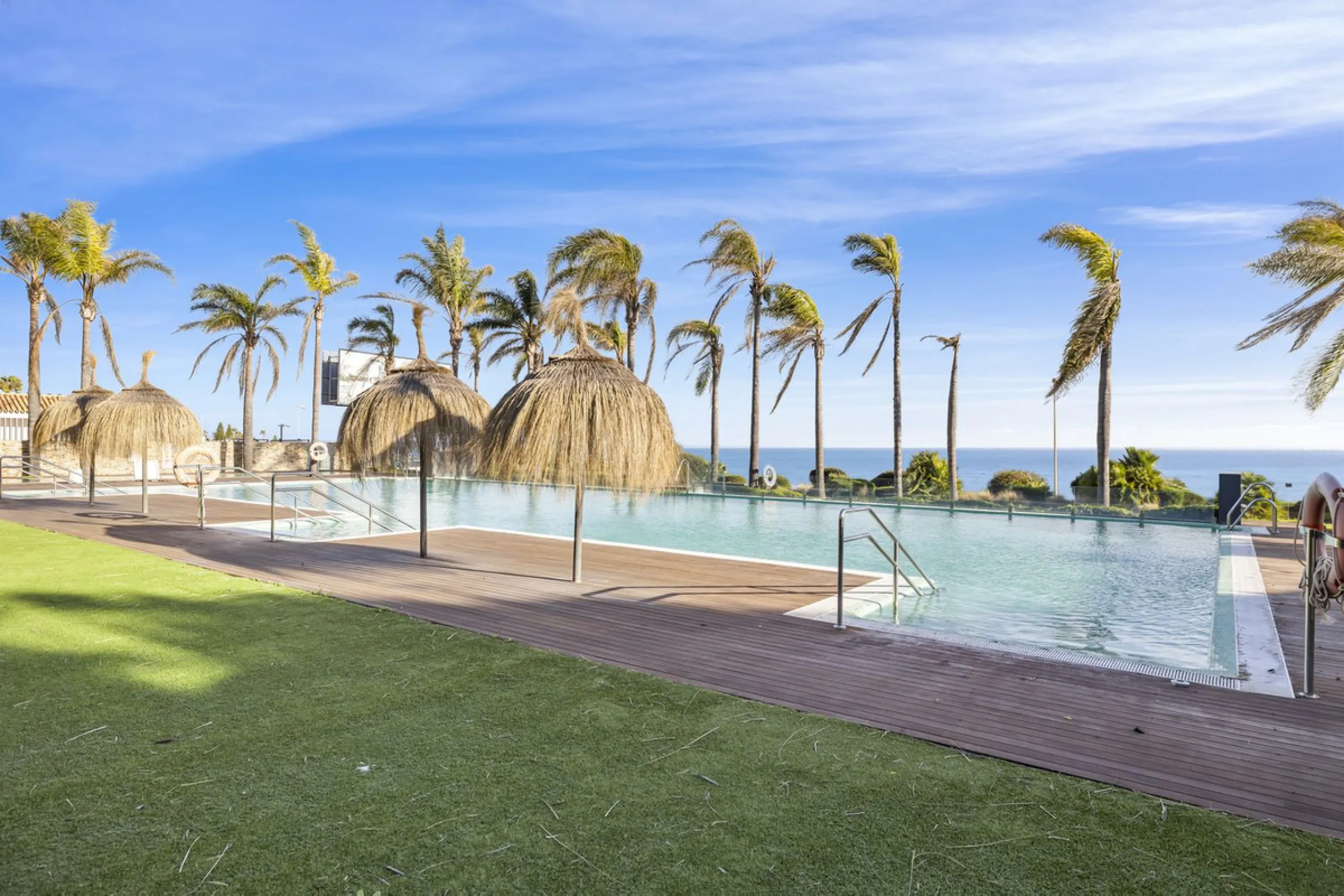 Discover this stylish first-floor apartment in the exclusive El Chaparral area of Mijas Costa, featuring a southwest orientation and a prime location between Fuengirola and La Cala de Mijas.