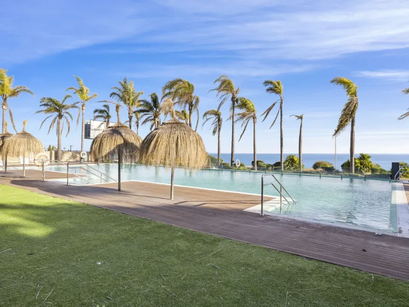 Discover this stylish first-floor apartment in the exclusive El Chaparral area of Mijas Costa, featuring a southwest orientation and a prime location between Fuengirola and La Cala de Mijas.