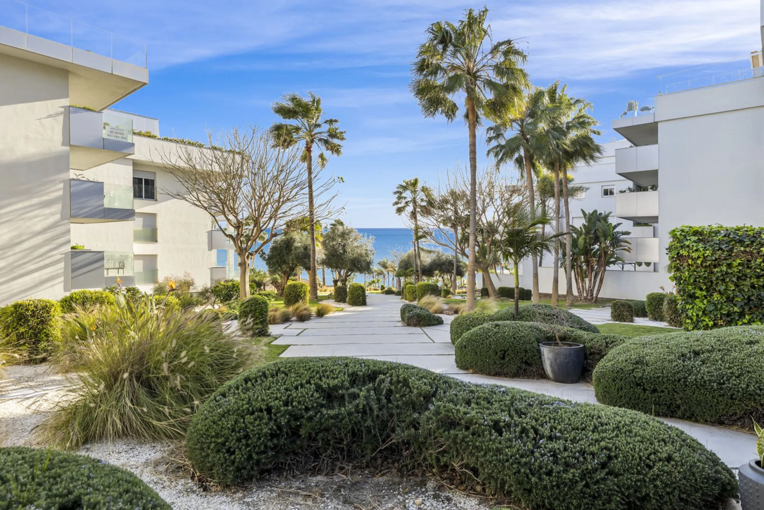 Discover this stylish first-floor apartment in the exclusive El Chaparral area of Mijas Costa, featuring a southwest orientation and a prime location between Fuengirola and La Cala de Mijas.