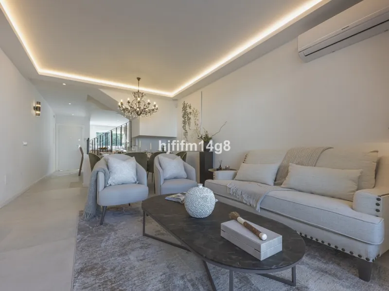 We are delighted to present this stunning, fully refurbished 4-bedroom townhouse located in the sought-after San Javier urbanisation in Nueva Andalucía, within the prestigious Marbella area. Set in a charming and very intimate residential community of jus