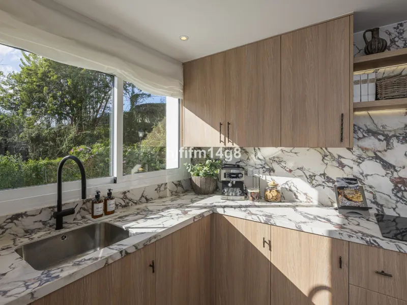 We are delighted to present this stunning, fully refurbished 4-bedroom townhouse located in the sought-after San Javier urbanisation in Nueva Andalucía, within the prestigious Marbella area. Set in a charming and very intimate residential community of jus