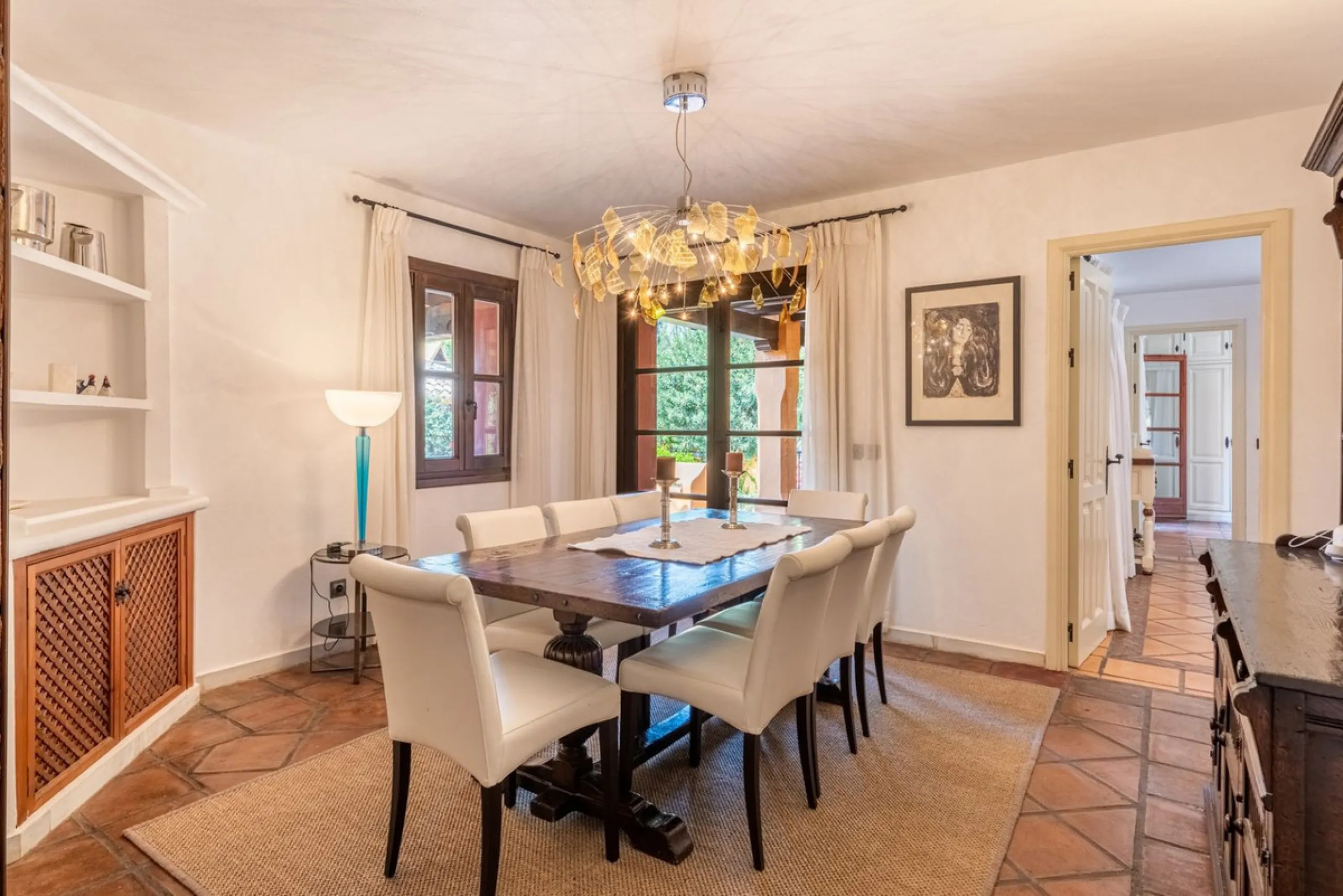 This Andalusian-style villa in El Paraiso Medio offers privacy, stunning views, and proximity to golf courses, and amenities.