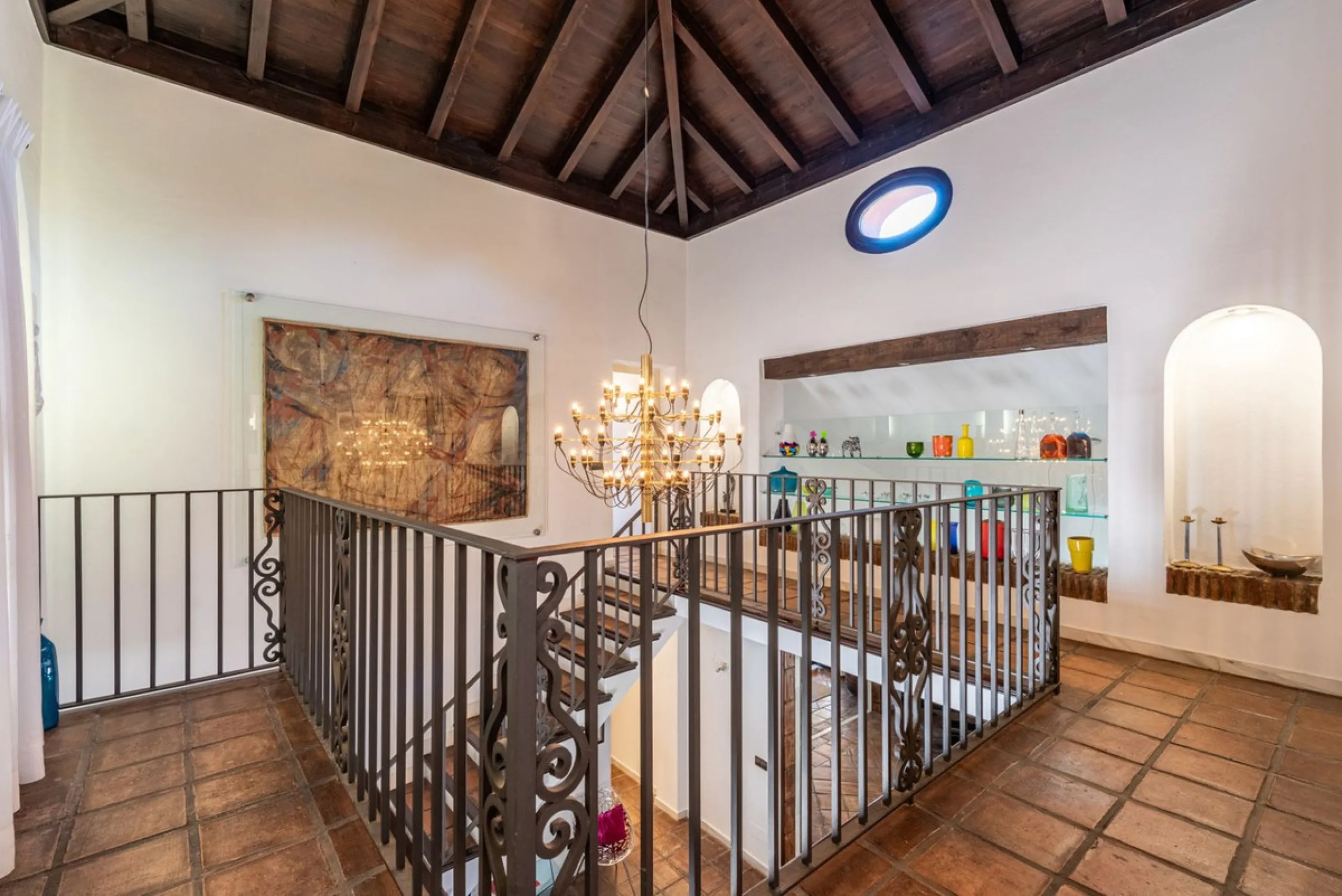 This Andalusian-style villa in El Paraiso Medio offers privacy, stunning views, and proximity to golf courses, and amenities.