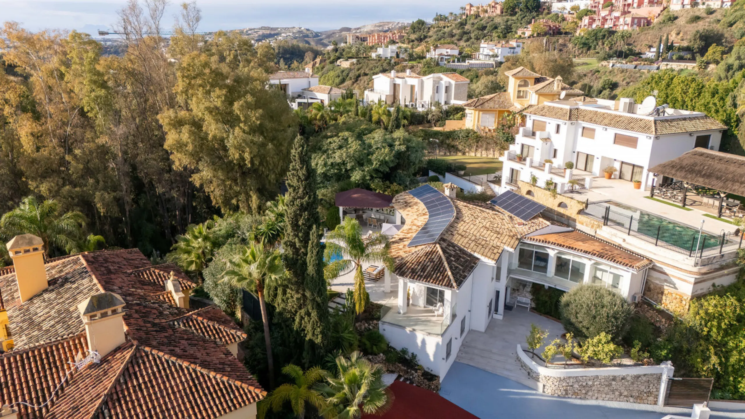 Introducing a stunning contemporary villa located in the prestigious, gated community of El Herrojo, Benahavís — one of Marbella's most desirable addresses. This elegant home combines modern luxury with serene Mediterranean living, offering privacy, secur