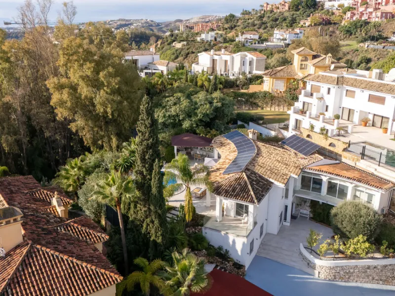 Introducing a stunning contemporary villa located in the prestigious, gated community of El Herrojo, Benahavís — one of Marbella's most desirable addresses. This elegant home combines modern luxury with serene Mediterranean living, offering privacy, secur