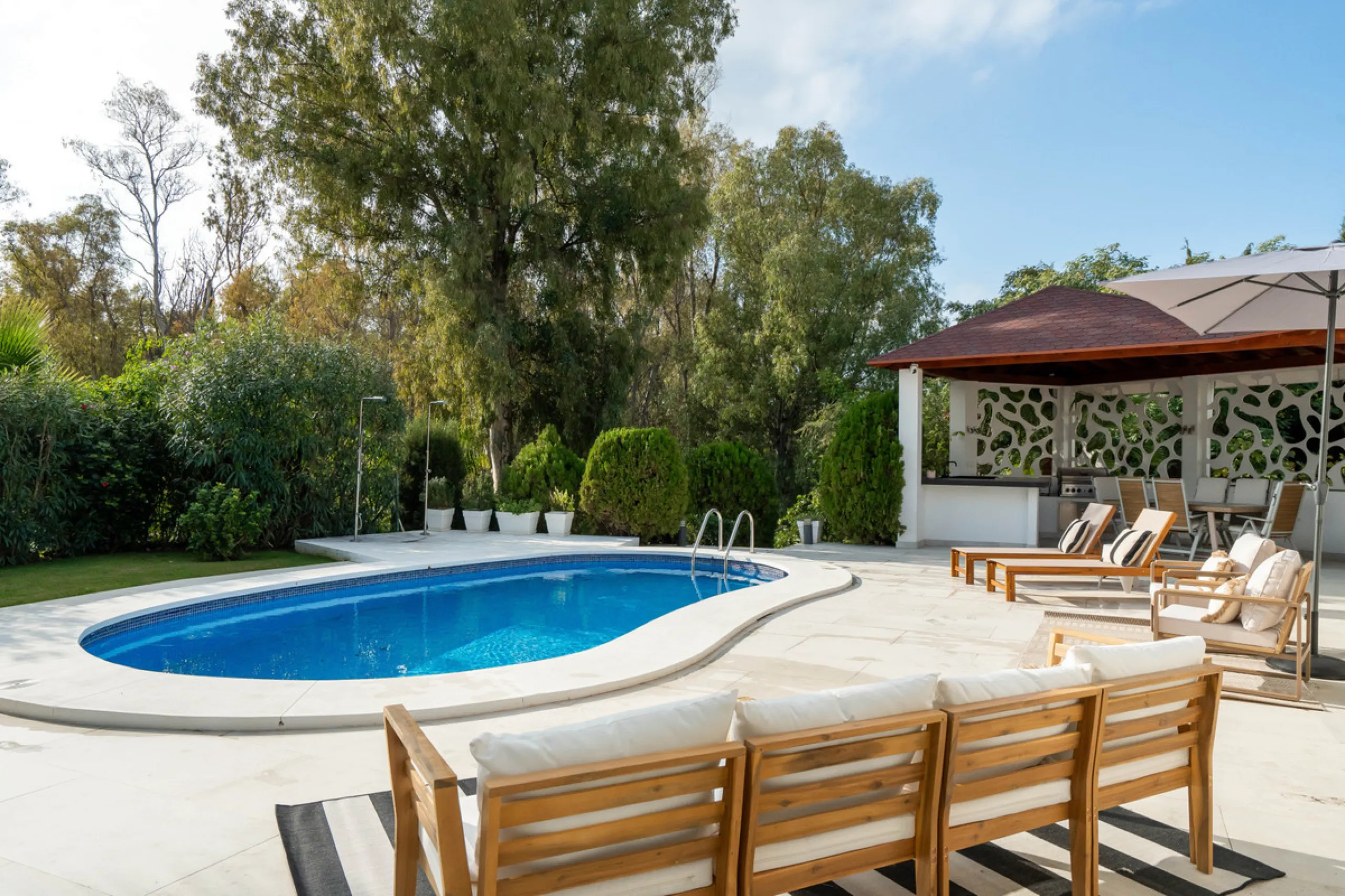 Introducing a stunning contemporary villa located in the prestigious, gated community of El Herrojo, Benahavís — one of Marbella's most desirable addresses. This elegant home combines modern luxury with serene Mediterranean living, offering privacy, secur