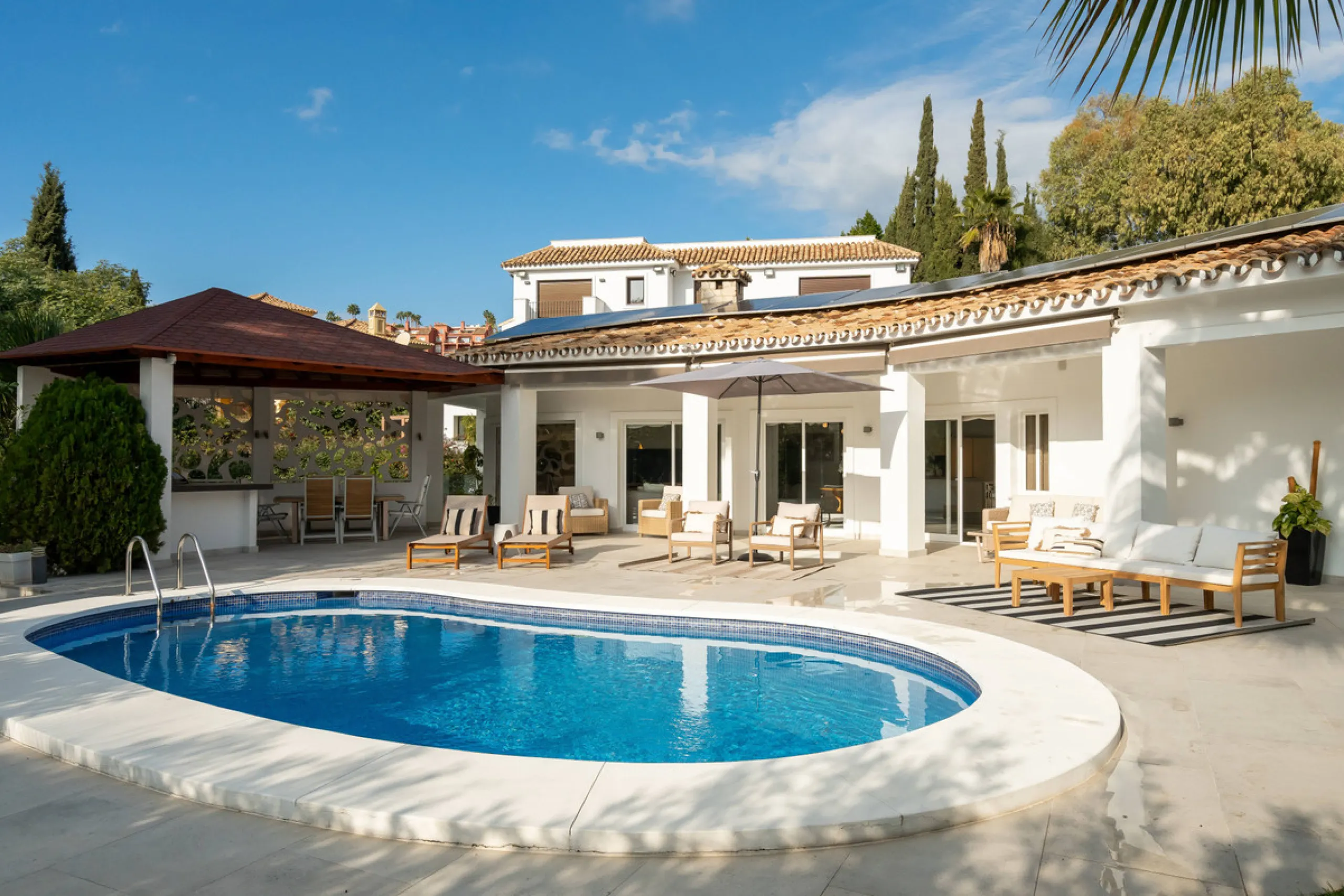 Introducing a stunning contemporary villa located in the prestigious, gated community of El Herrojo, Benahavís — one of Marbella's most desirable addresses. This elegant home combines modern luxury with serene Mediterranean living, offering privacy, secur