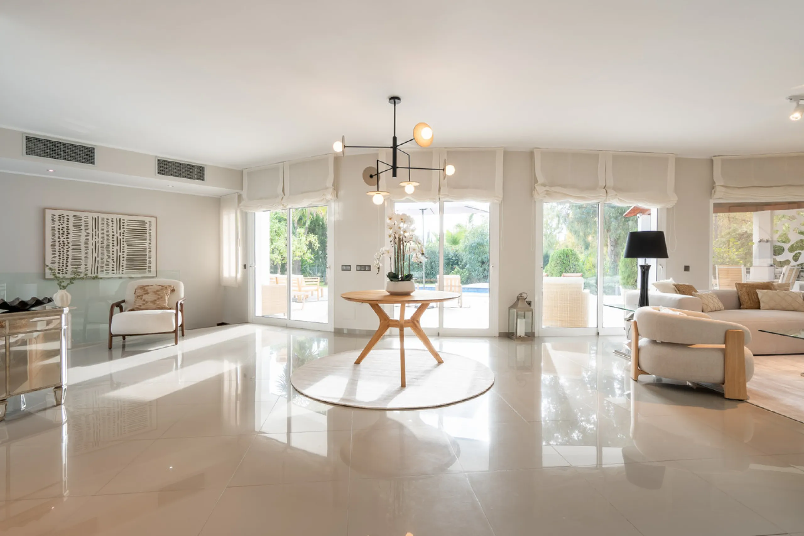 Introducing a stunning contemporary villa located in the prestigious, gated community of El Herrojo, Benahavís — one of Marbella's most desirable addresses. This elegant home combines modern luxury with serene Mediterranean living, offering privacy, secur