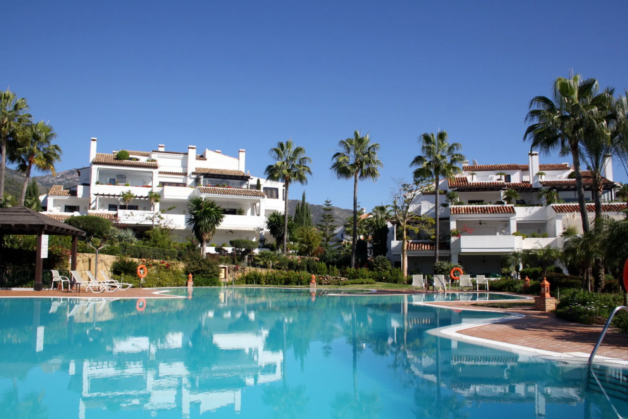 Superb south west facing first floor apartment with panoramic sea views within a five star complex in a luxurious gated urbanisation off the Golden Mile, Marbella.