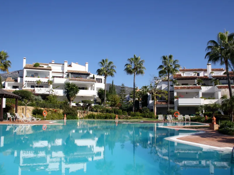Superb south west facing first floor apartment with panoramic sea views within a five star complex in a luxurious gated urbanisation off the Golden Mile, Marbella.