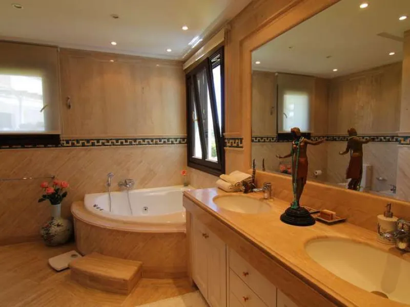 Superb south west facing first floor apartment with panoramic sea views within a five star complex in a luxurious gated urbanisation off the Golden Mile, Marbella.