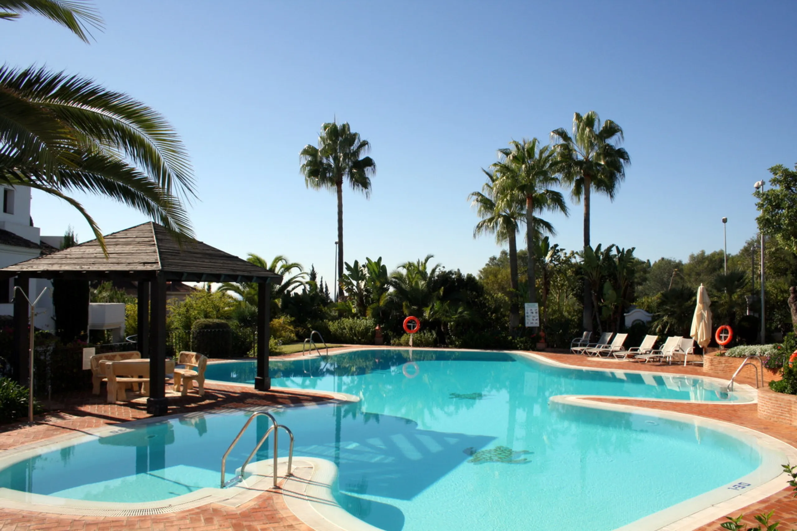 Superb south west facing first floor apartment with panoramic sea views within a five star complex in a luxurious gated urbanisation off the Golden Mile, Marbella.