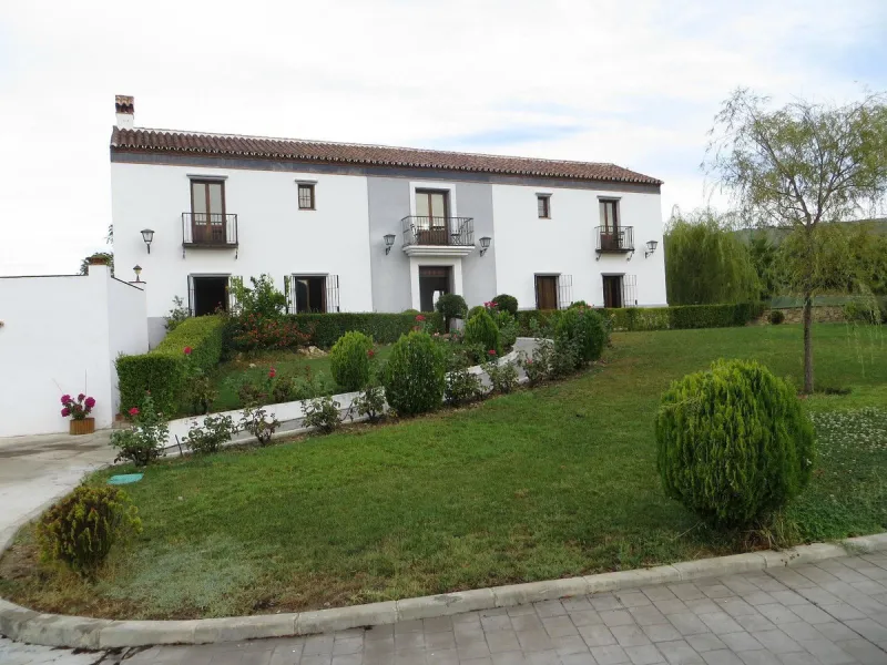 Discover the ultimate Andalusian retreat. A 4-star boutique estate offers a rare blend of historic charm and modern luxury, just 10 minutes from the iconic center of Ronda. This impeccably restored 7-bedroom Cortijo (traditional farmhouse) nestled in the 