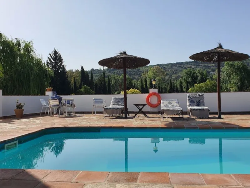 Discover the ultimate Andalusian retreat. A 4-star boutique estate offers a rare blend of historic charm and modern luxury, just 10 minutes from the iconic center of Ronda. This impeccably restored 7-bedroom Cortijo (traditional farmhouse) nestled in the 