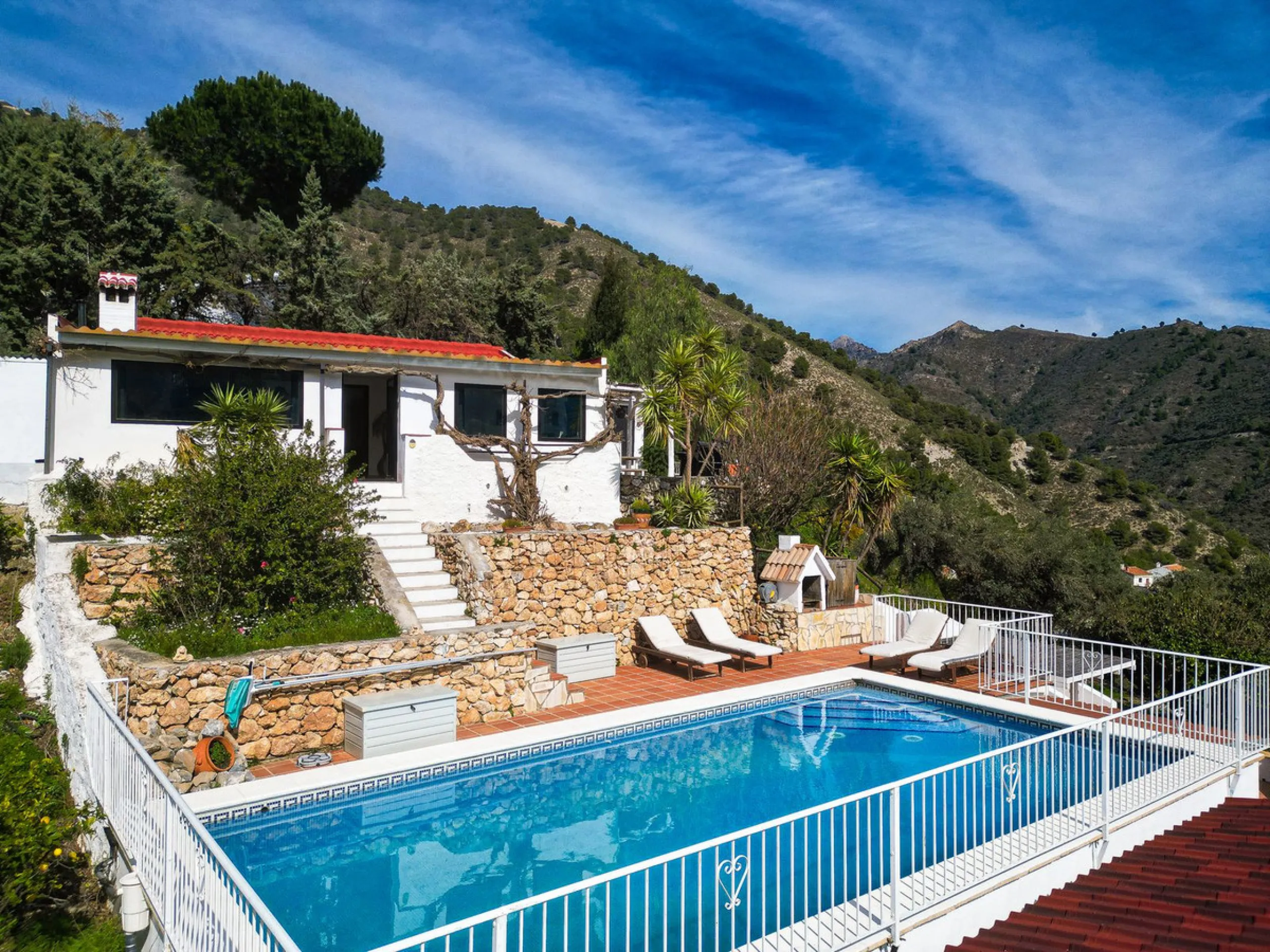 Beautiful countryside villa located in a peaceful valley setting, just a short drive from the vibrant town of Cómpeta. This beautiful country house has been renovated to the highest standards of quality and elegance, offering a refined modern-zen style fi