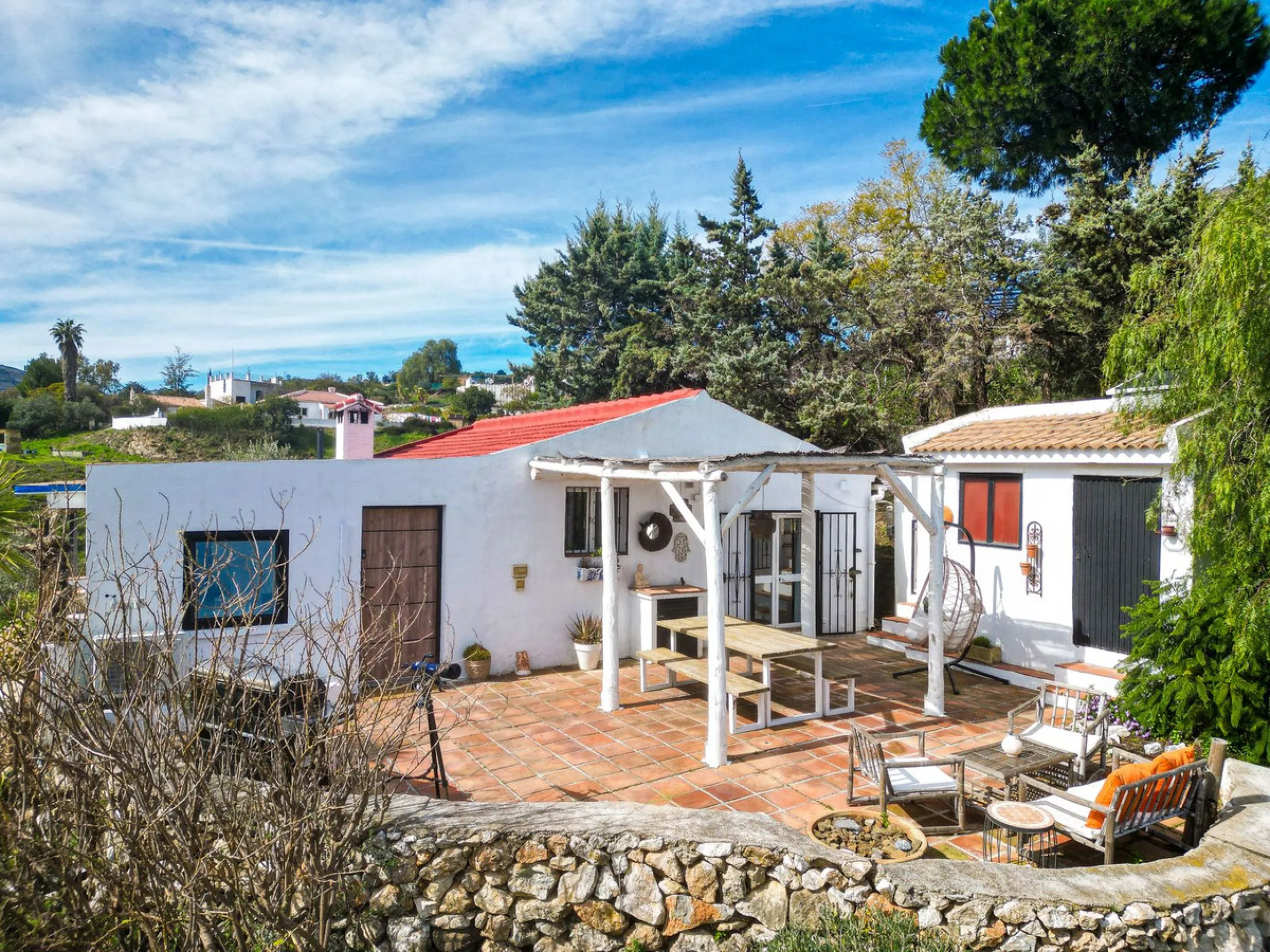 Beautiful countryside villa located in a peaceful valley setting, just a short drive from the vibrant town of Cómpeta. This beautiful country house has been renovated to the highest standards of quality and elegance, offering a refined modern-zen style fi