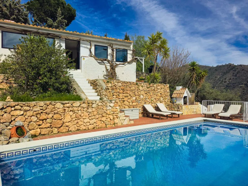 Beautiful countryside villa located in a peaceful valley setting, just a short drive from the vibrant town of Cómpeta. This beautiful country house has been renovated to the highest standards of quality and elegance, offering a refined modern-zen style fi