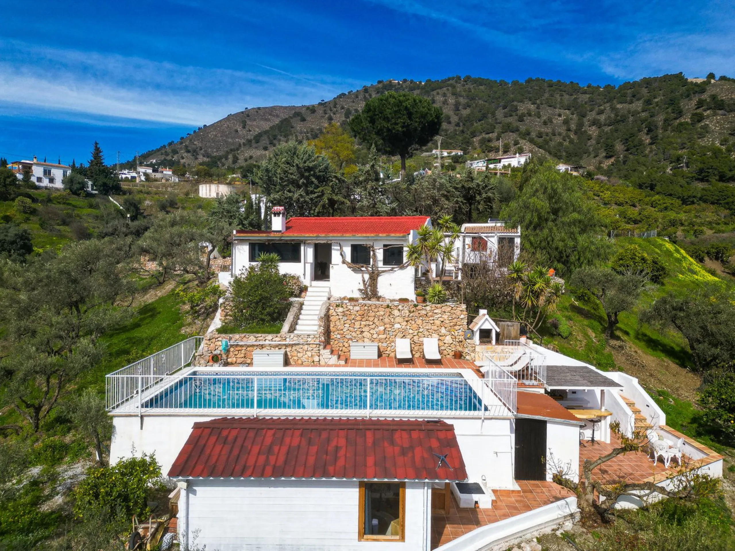 Beautiful countryside villa located in a peaceful valley setting, just a short drive from the vibrant town of Cómpeta. This beautiful country house has been renovated to the highest standards of quality and elegance, offering a refined modern-zen style fi