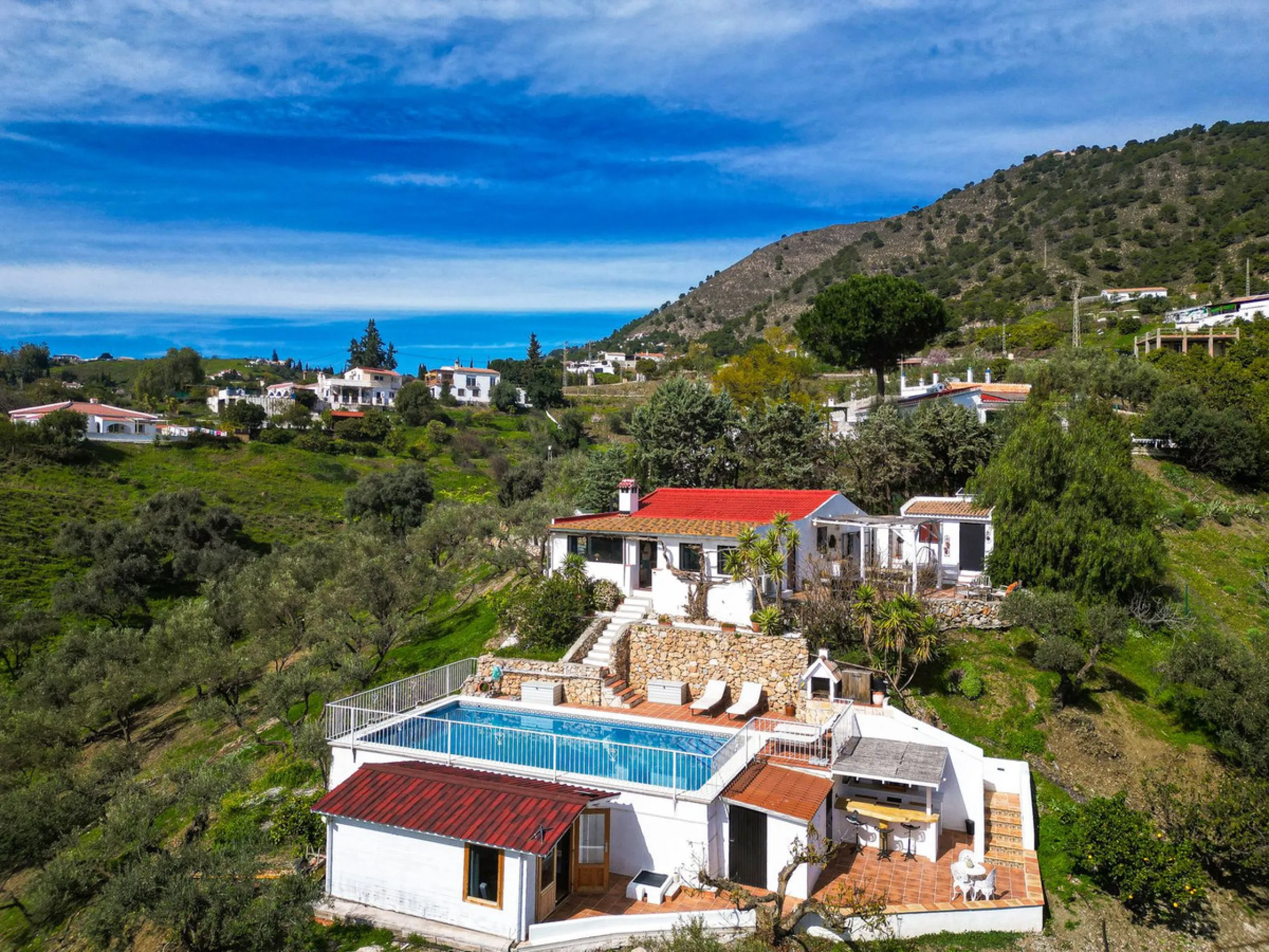 Beautiful countryside villa located in a peaceful valley setting, just a short drive from the vibrant town of Cómpeta. This beautiful country house has been renovated to the highest standards of quality and elegance, offering a refined modern-zen style fi