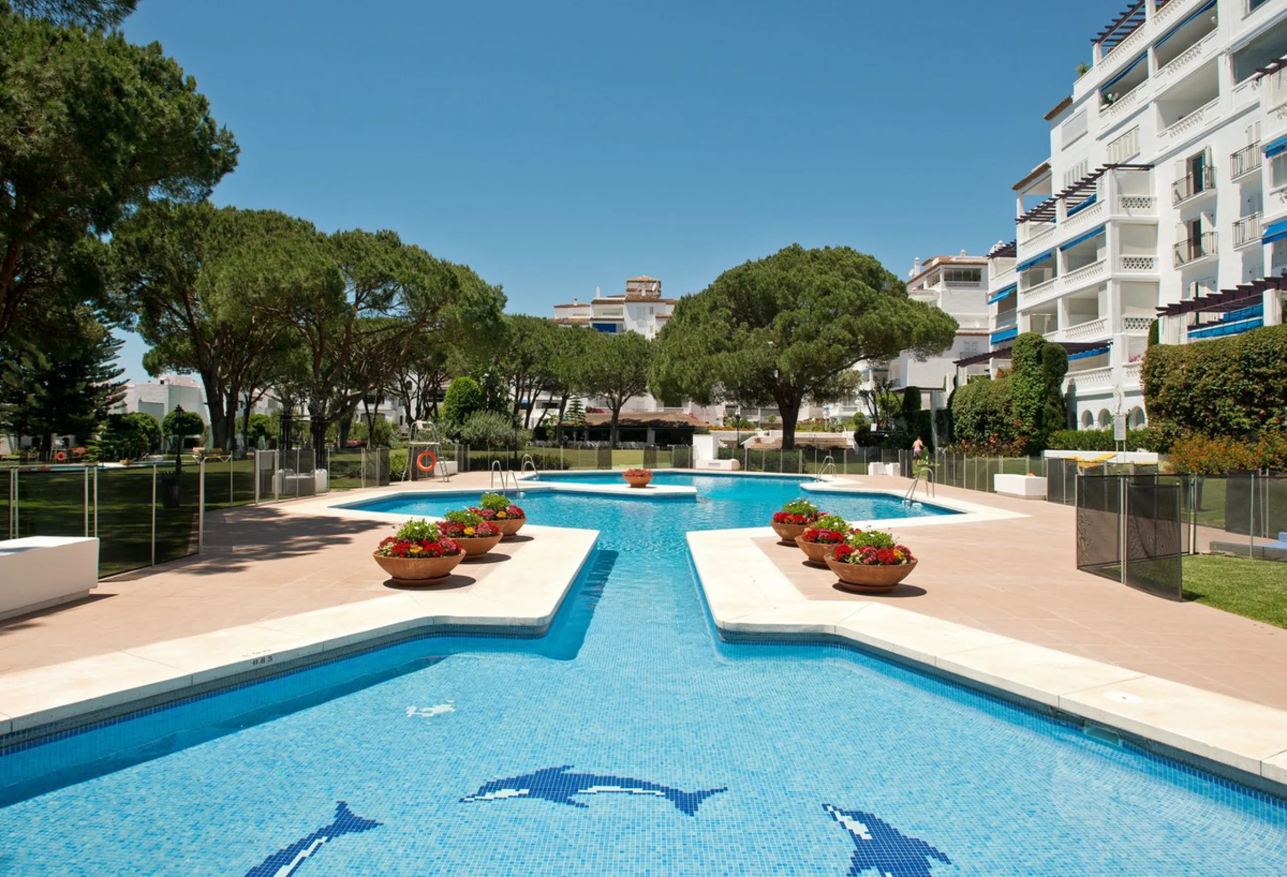 A prime apartment for sale in Puerto Banús, located within the prestigious beachfront Club Playas del Duque complex.