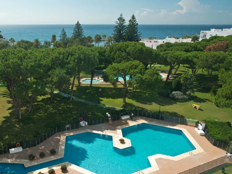 A prime apartment for sale in Puerto Banús, located within the prestigious beachfront Club Playas del Duque complex.