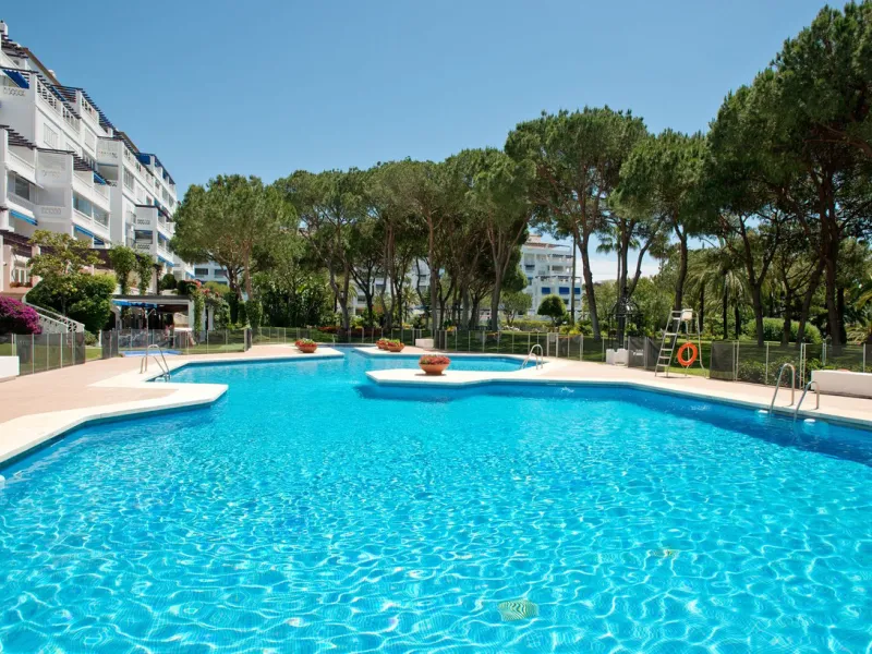 A prime apartment for sale in Puerto Banús, located within the prestigious beachfront Club Playas del Duque complex.