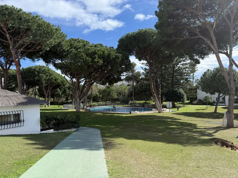 A prime apartment for sale in Puerto Banús, located within the prestigious beachfront Club Playas del Duque complex.