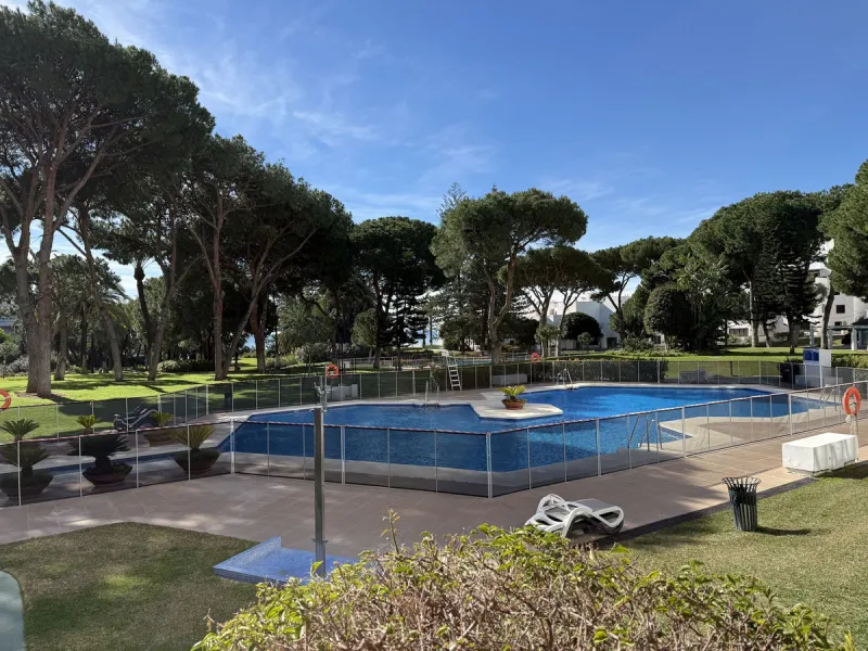 A prime apartment for sale in Puerto Banús, located within the prestigious beachfront Club Playas del Duque complex.