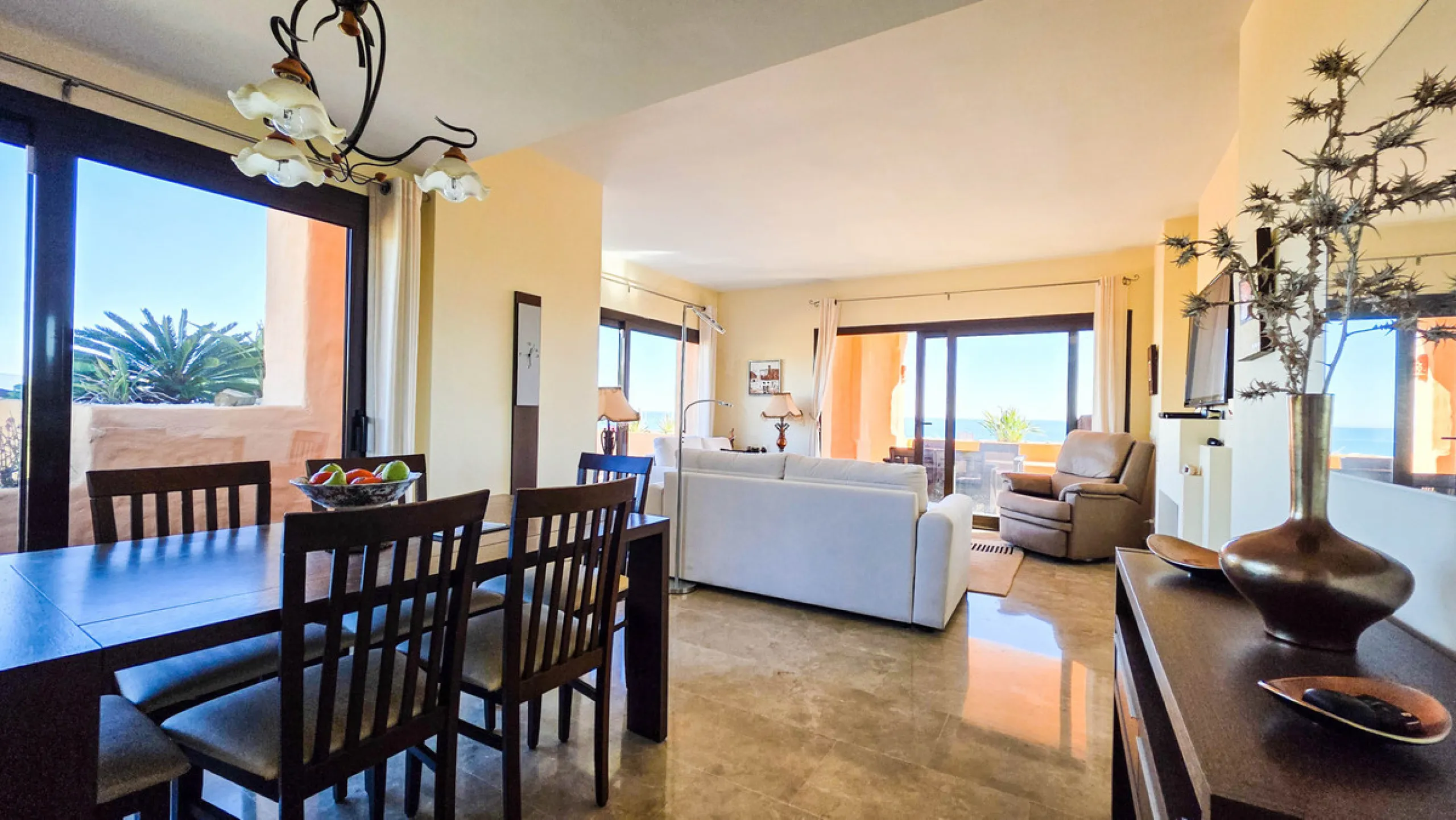 Positioned in a prime corner location within Phase 1 of a well-established development in La Duquesa, this penthouse offers panoramic sea views that truly define the property. From its elevated setting, the Mediterranean stretches across the horizon, crea