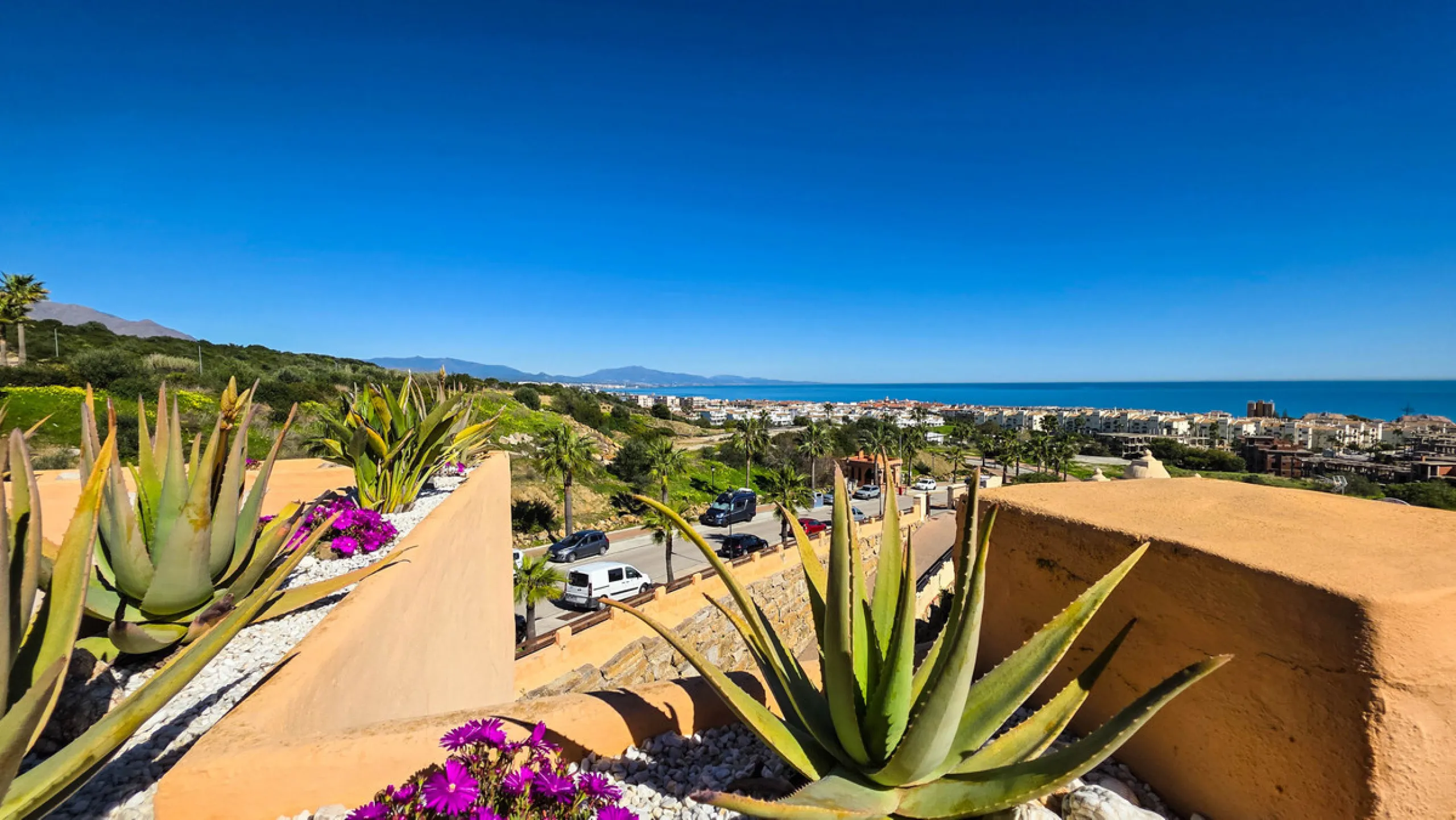 Positioned in a prime corner location within Phase 1 of a well-established development in La Duquesa, this penthouse offers panoramic sea views that truly define the property. From its elevated setting, the Mediterranean stretches across the horizon, crea