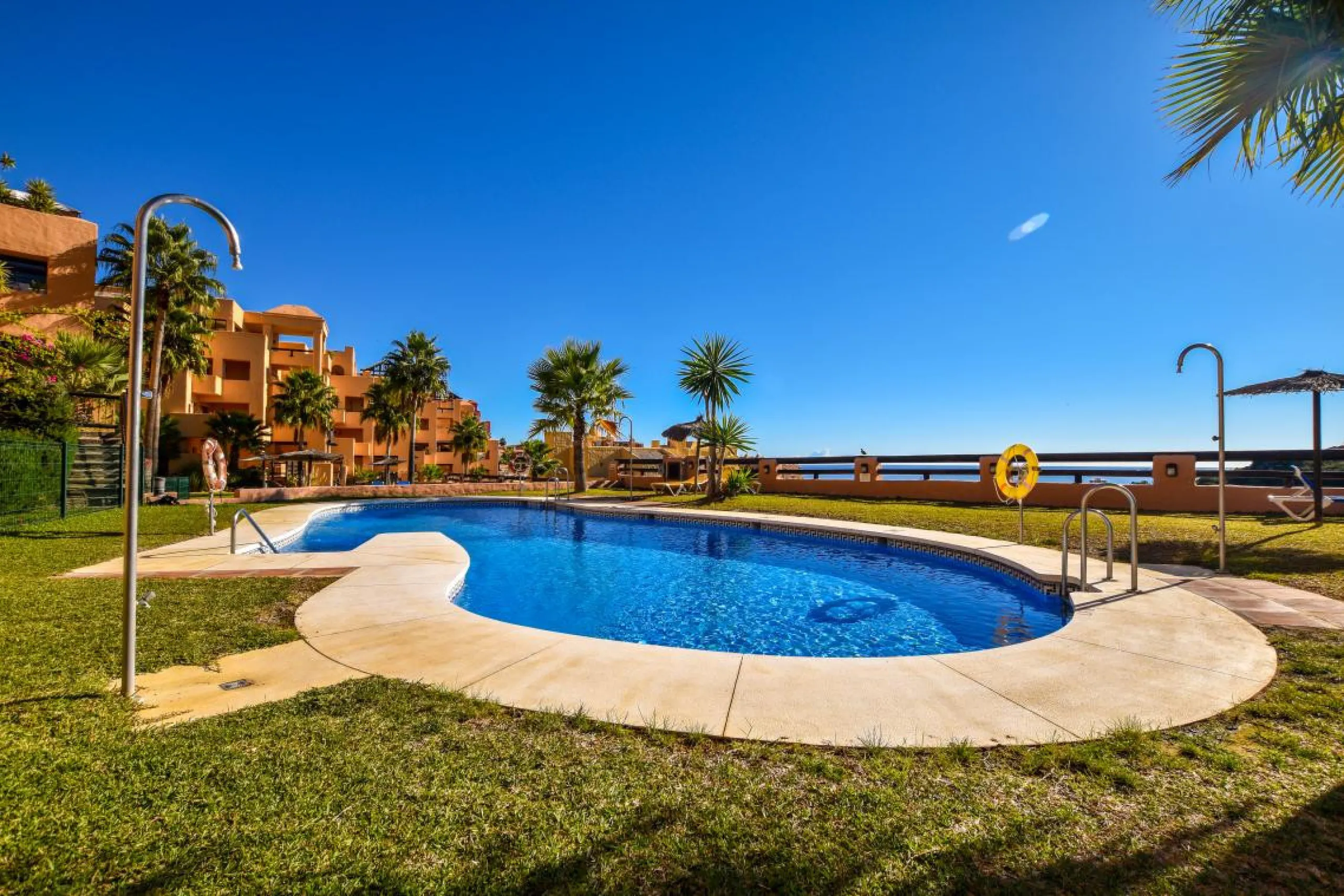 Positioned in a prime corner location within Phase 1 of a well-established development in La Duquesa, this penthouse offers panoramic sea views that truly define the property. From its elevated setting, the Mediterranean stretches across the horizon, crea