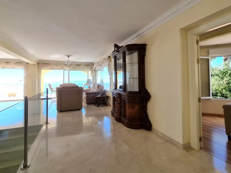 Located in the prestigious La Capellania area of the Costa del Sol, this exceptional 5-bedroom villa masterfully blends modern luxury with timeless Mediterranean charm, offering breathtaking panoramic sea views and an enviable lifestyle in one of southern