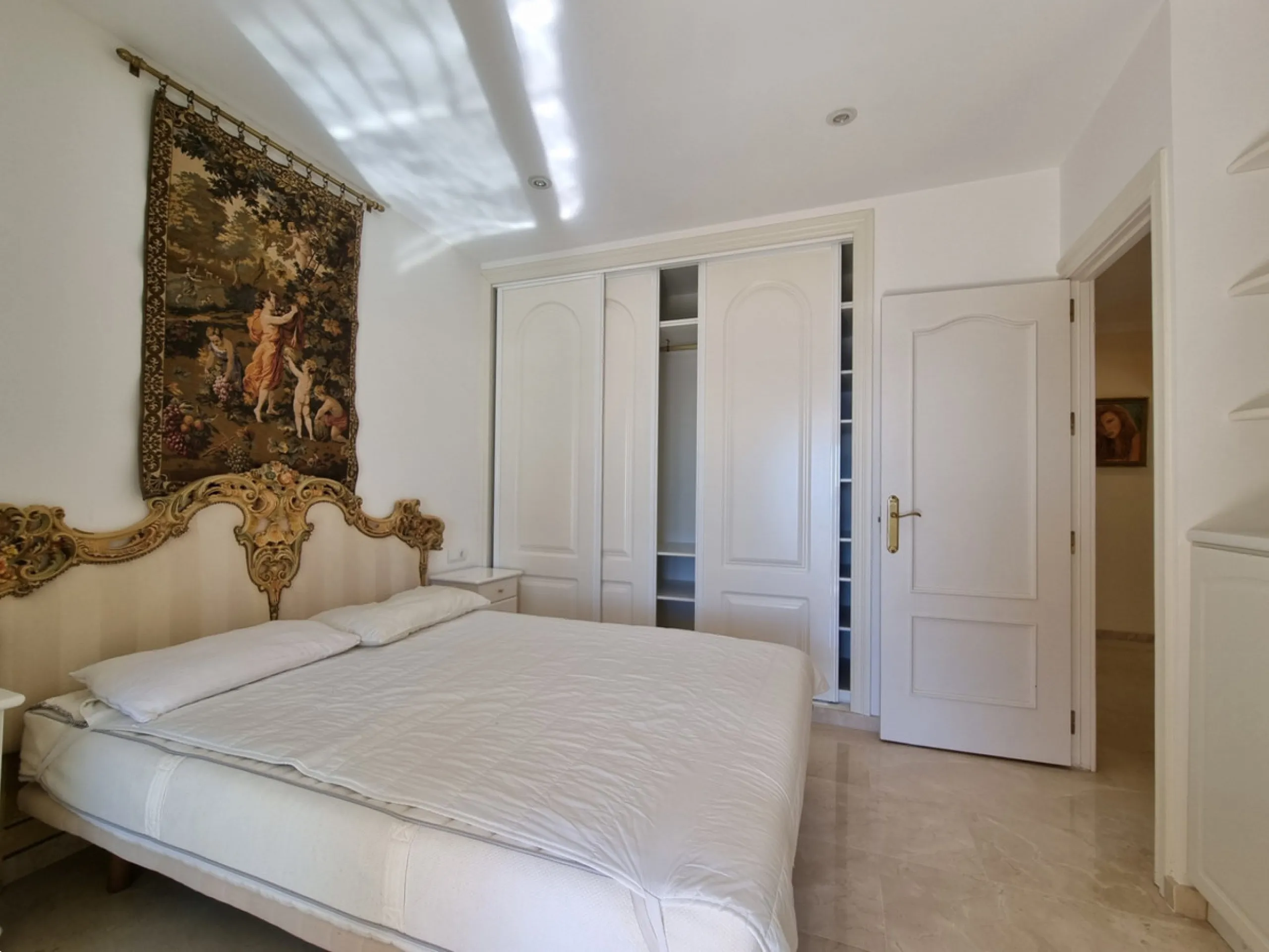 Located in the prestigious La Capellania area of the Costa del Sol, this exceptional 5-bedroom villa masterfully blends modern luxury with timeless Mediterranean charm, offering breathtaking panoramic sea views and an enviable lifestyle in one of southern