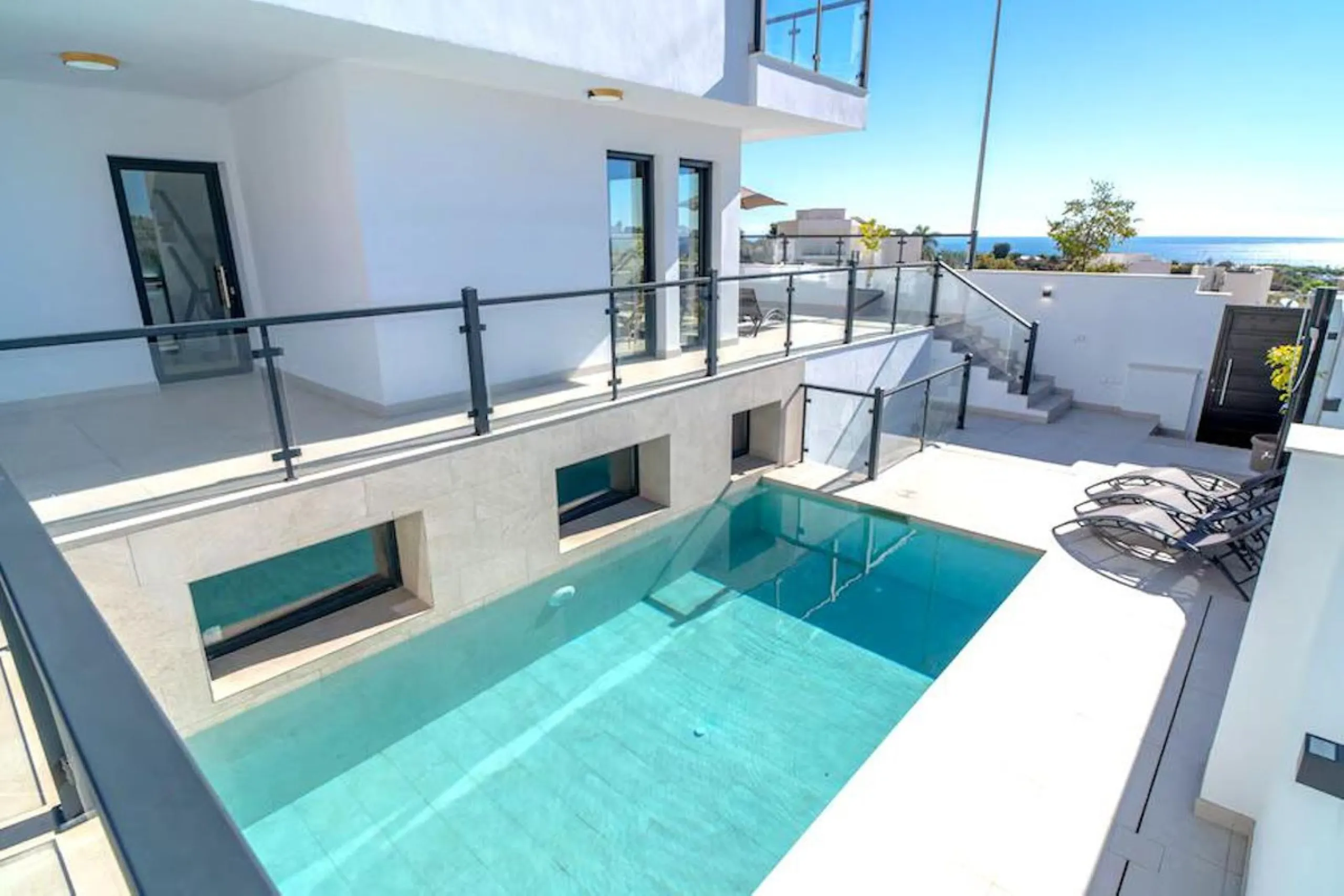 This elegant modern villa blends clean architectural lines with a warm, comfortable feel, set within a quiet residential area just outside Nerja. From its elevated position, the property enjoys spectacular views of both the sea and surrounding mountains.