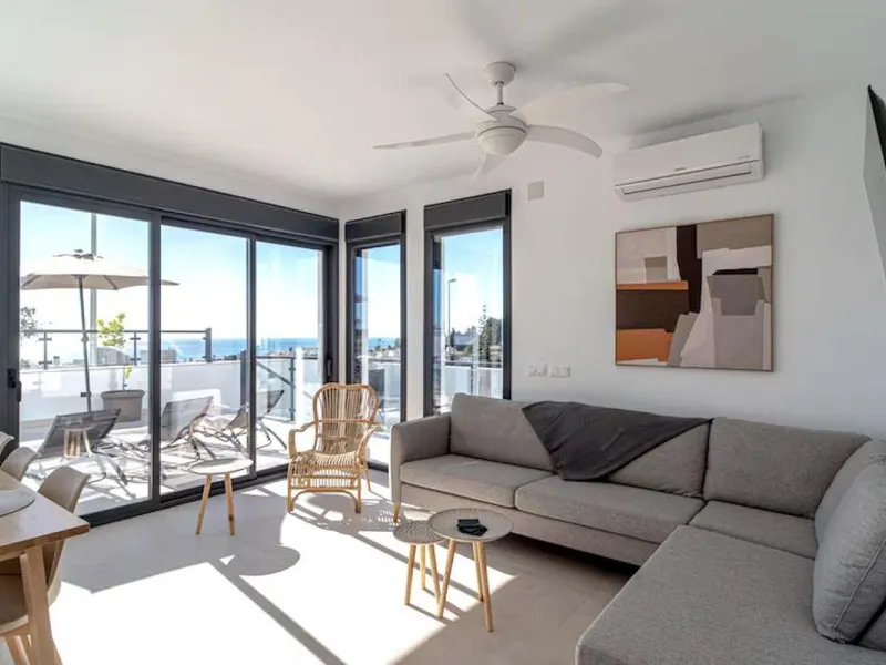 This elegant modern villa blends clean architectural lines with a warm, comfortable feel, set within a quiet residential area just outside Nerja. From its elevated position, the property enjoys spectacular views of both the sea and surrounding mountains.