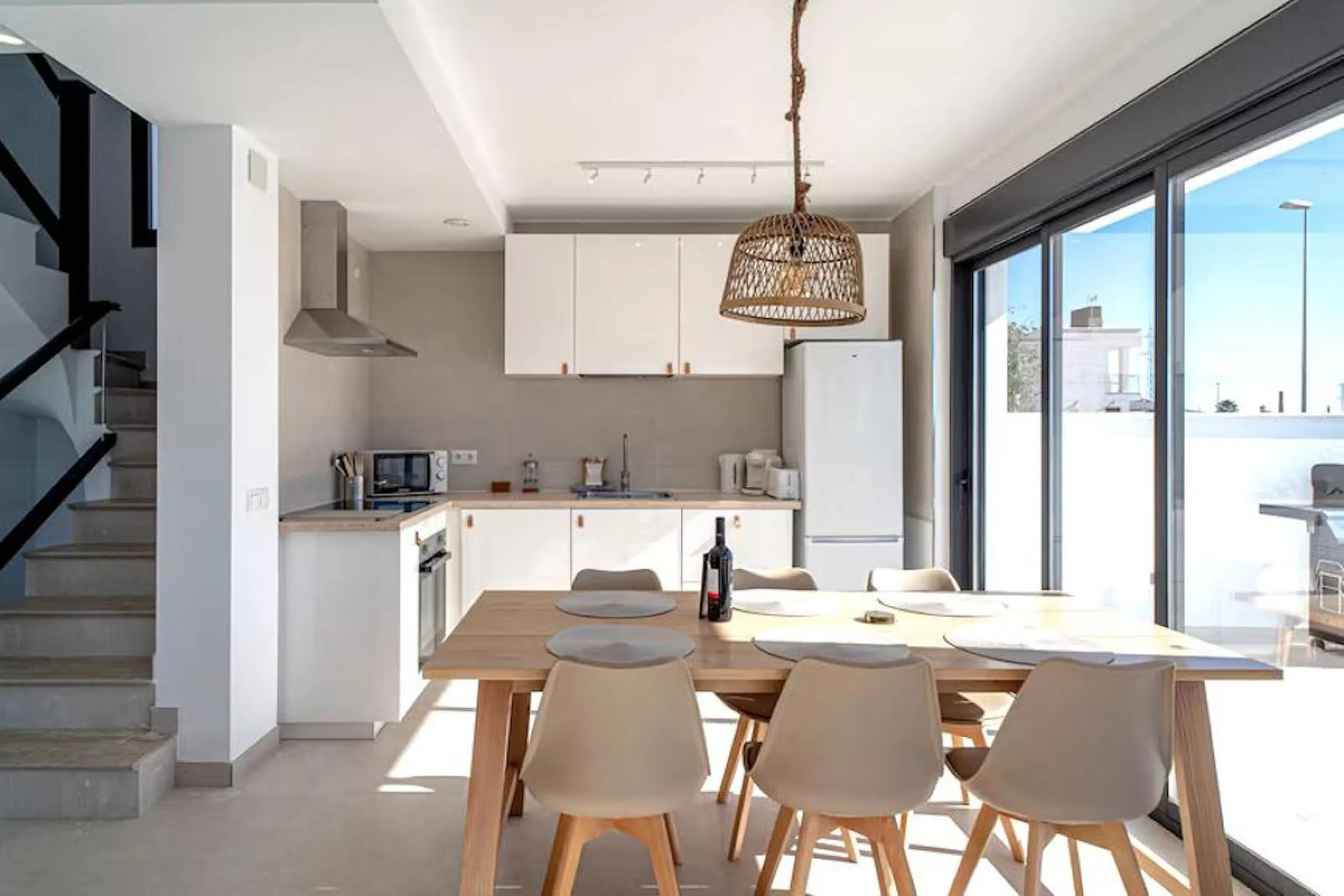 This elegant modern villa blends clean architectural lines with a warm, comfortable feel, set within a quiet residential area just outside Nerja. From its elevated position, the property enjoys spectacular views of both the sea and surrounding mountains.