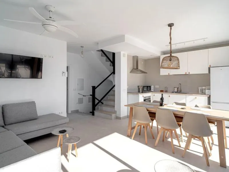 This elegant modern villa blends clean architectural lines with a warm, comfortable feel, set within a quiet residential area just outside Nerja. From its elevated position, the property enjoys spectacular views of both the sea and surrounding mountains.
