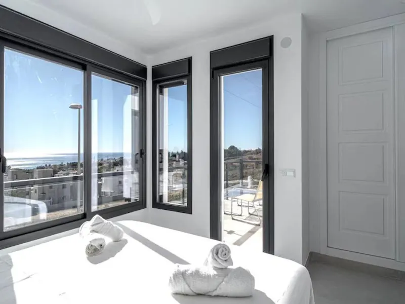 This elegant modern villa blends clean architectural lines with a warm, comfortable feel, set within a quiet residential area just outside Nerja. From its elevated position, the property enjoys spectacular views of both the sea and surrounding mountains.