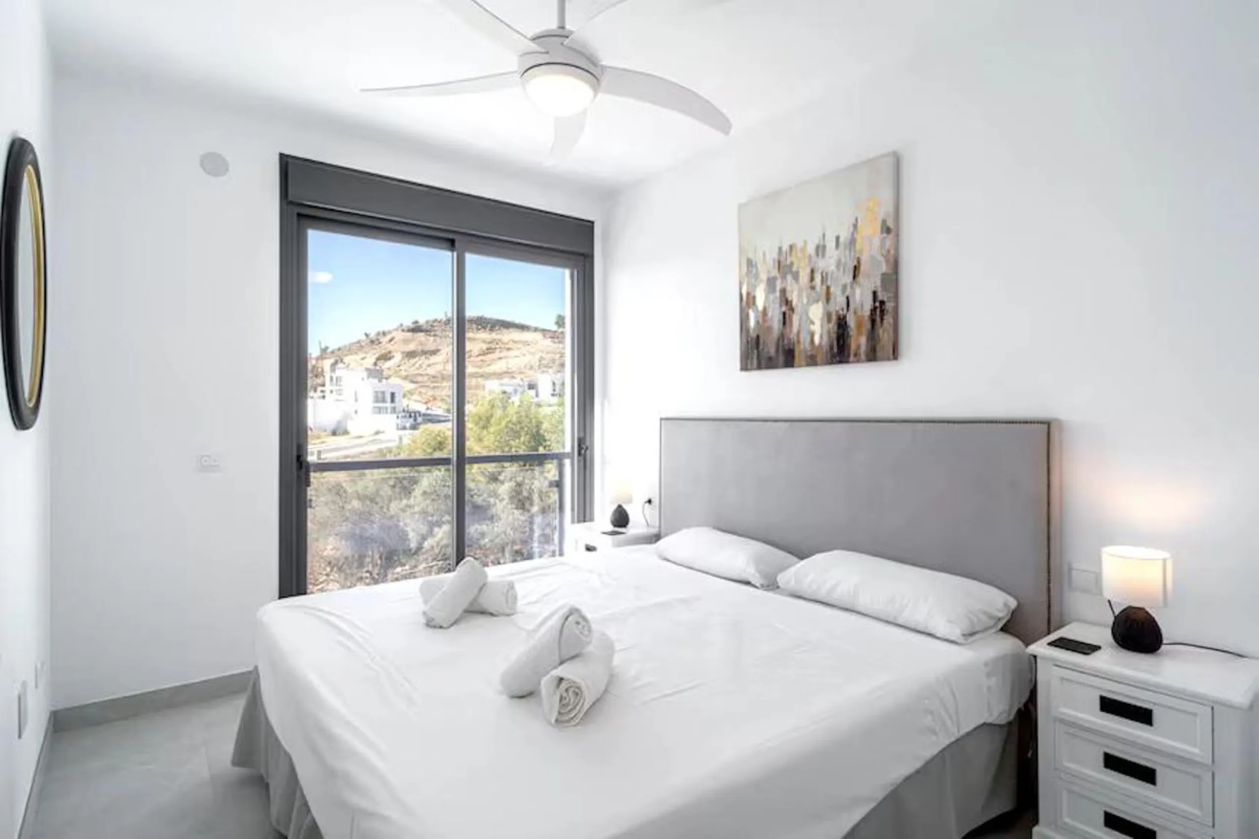 This elegant modern villa blends clean architectural lines with a warm, comfortable feel, set within a quiet residential area just outside Nerja. From its elevated position, the property enjoys spectacular views of both the sea and surrounding mountains.
