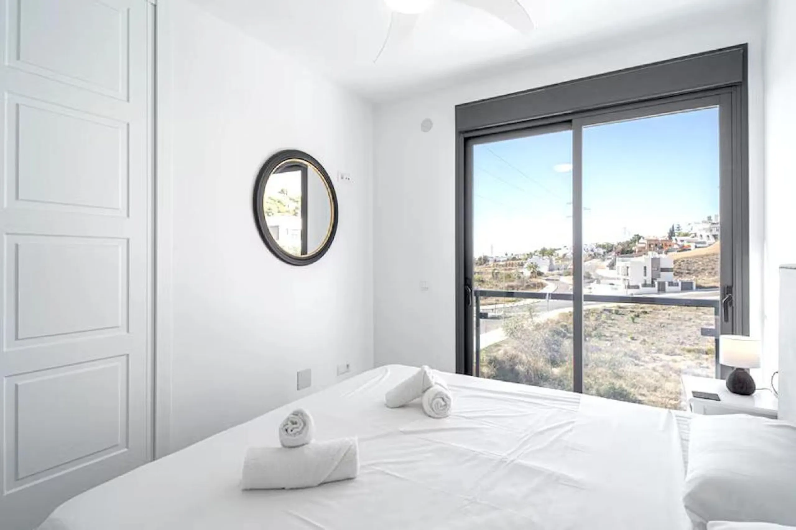 This elegant modern villa blends clean architectural lines with a warm, comfortable feel, set within a quiet residential area just outside Nerja. From its elevated position, the property enjoys spectacular views of both the sea and surrounding mountains.