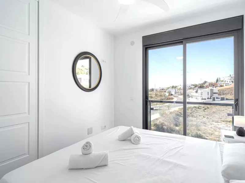 This elegant modern villa blends clean architectural lines with a warm, comfortable feel, set within a quiet residential area just outside Nerja. From its elevated position, the property enjoys spectacular views of both the sea and surrounding mountains.
