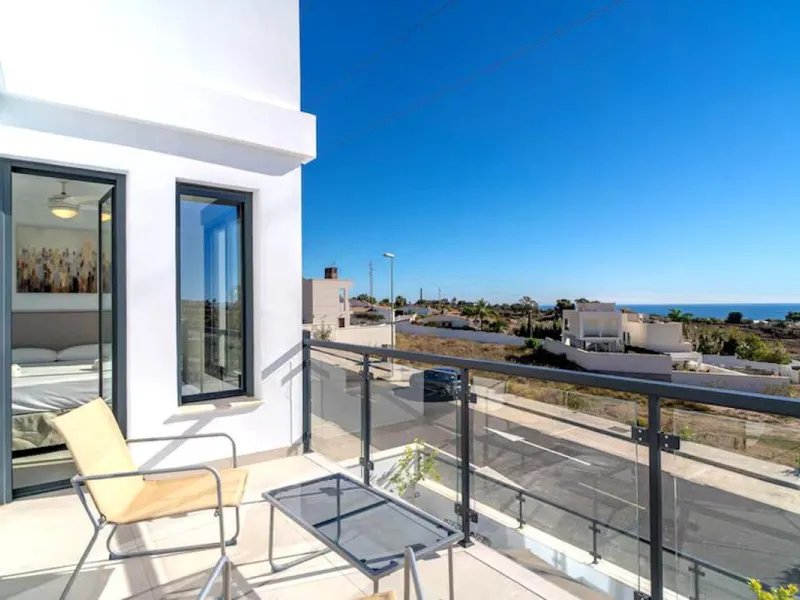 This elegant modern villa blends clean architectural lines with a warm, comfortable feel, set within a quiet residential area just outside Nerja. From its elevated position, the property enjoys spectacular views of both the sea and surrounding mountains.