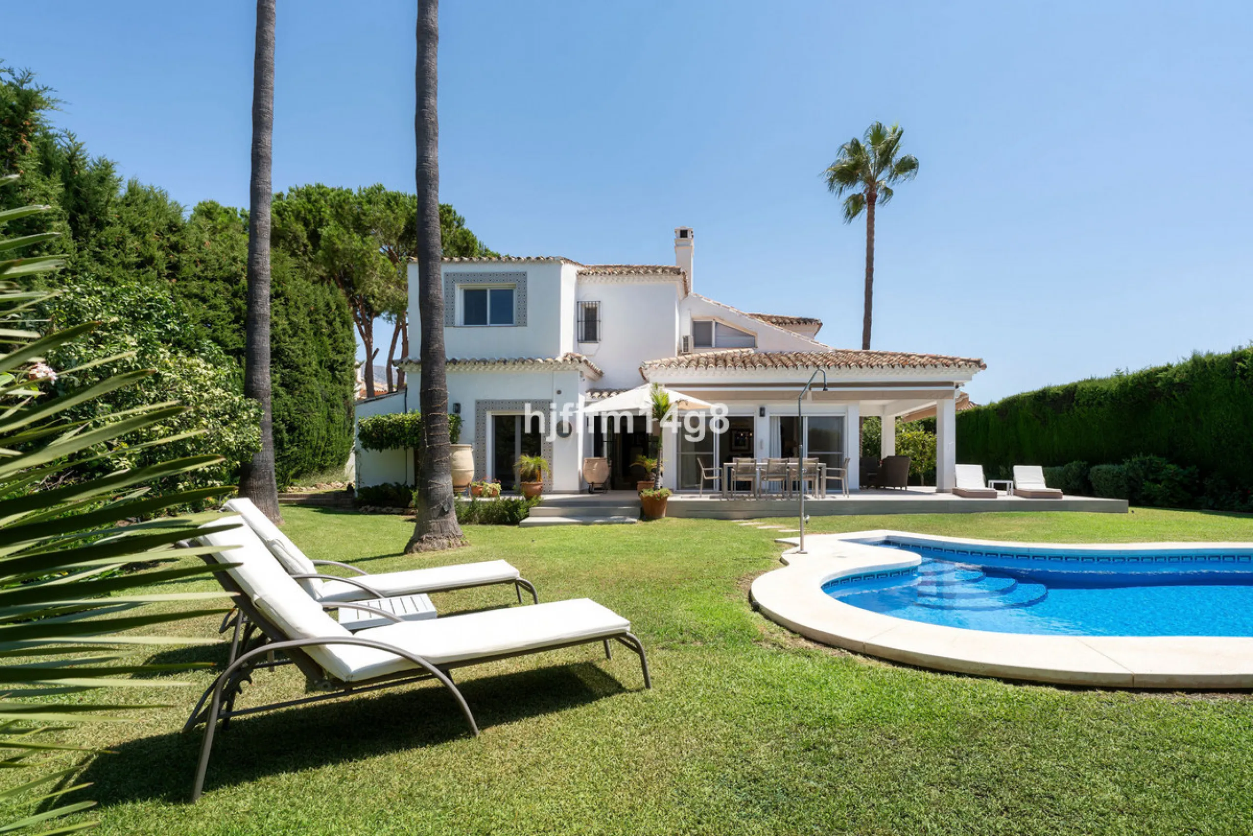 This charming villa is tucked away in a peaceful cul-de-sac within the exclusive gated community of Marbella Country Club, one of Nueva Andalucía's most desirable residential areas. Set on a flat and private south-facing plot, the property offers a perfec