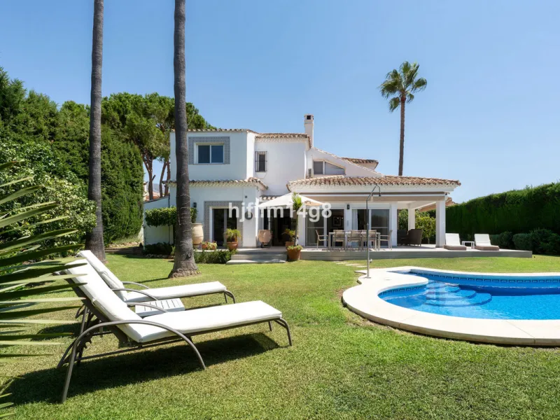 This charming villa is tucked away in a peaceful cul-de-sac within the exclusive gated community of Marbella Country Club, one of Nueva Andalucía's most desirable residential areas. Set on a flat and private south-facing plot, the property offers a perfec