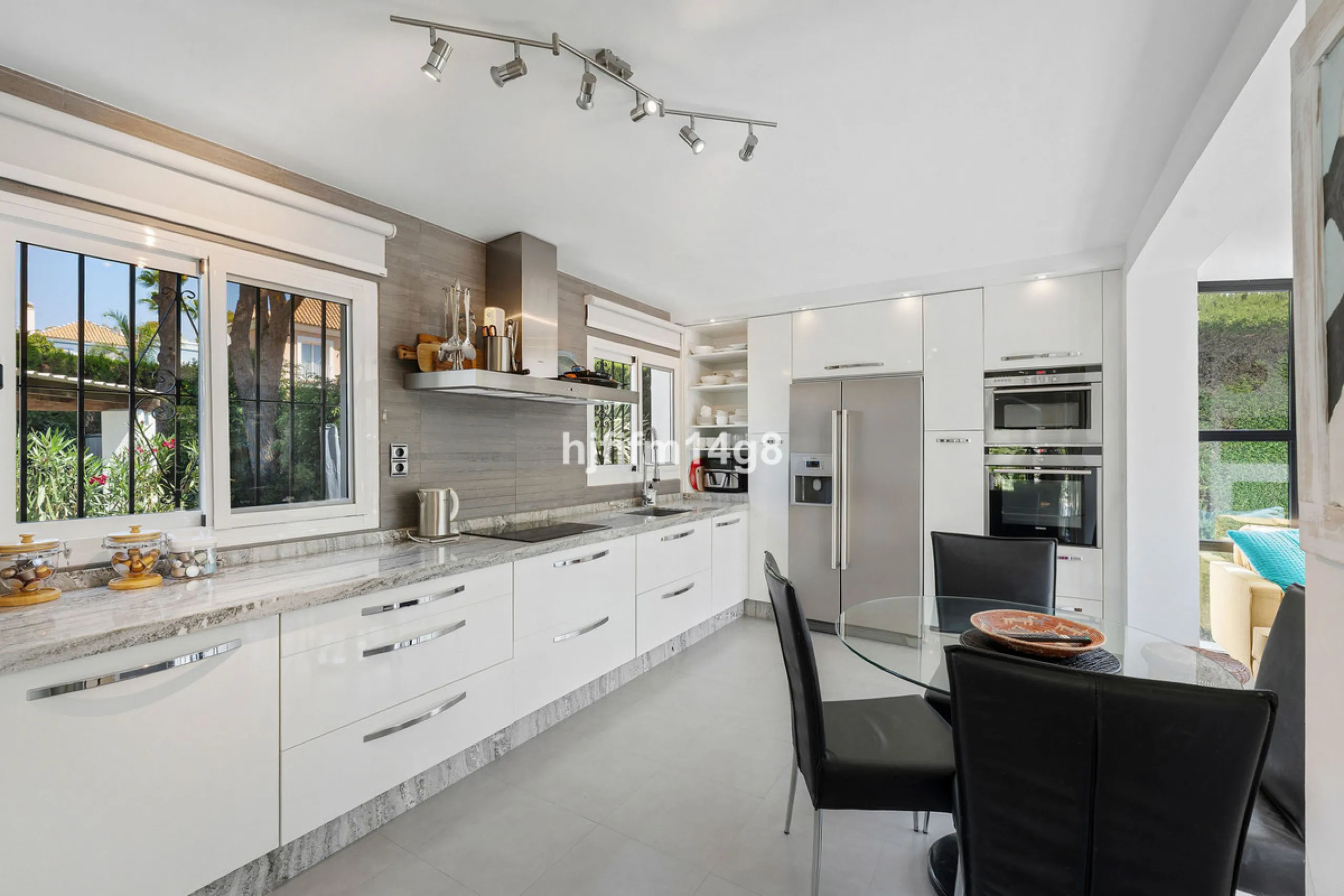 This charming villa is tucked away in a peaceful cul-de-sac within the exclusive gated community of Marbella Country Club, one of Nueva Andalucía's most desirable residential areas. Set on a flat and private south-facing plot, the property offers a perfec