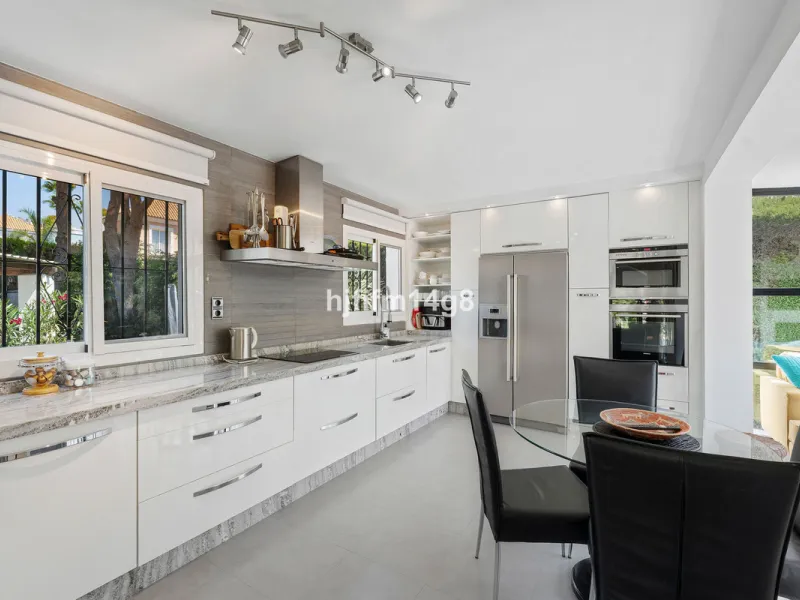 This charming villa is tucked away in a peaceful cul-de-sac within the exclusive gated community of Marbella Country Club, one of Nueva Andalucía's most desirable residential areas. Set on a flat and private south-facing plot, the property offers a perfec